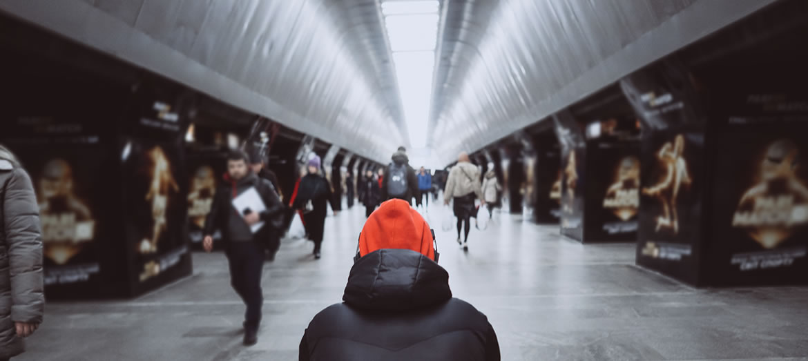 people walking through subway station