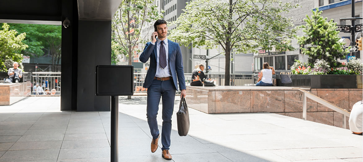 Business man walking outside